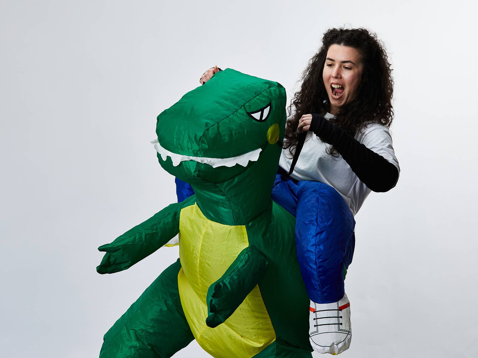 Emma riding a dinosaur