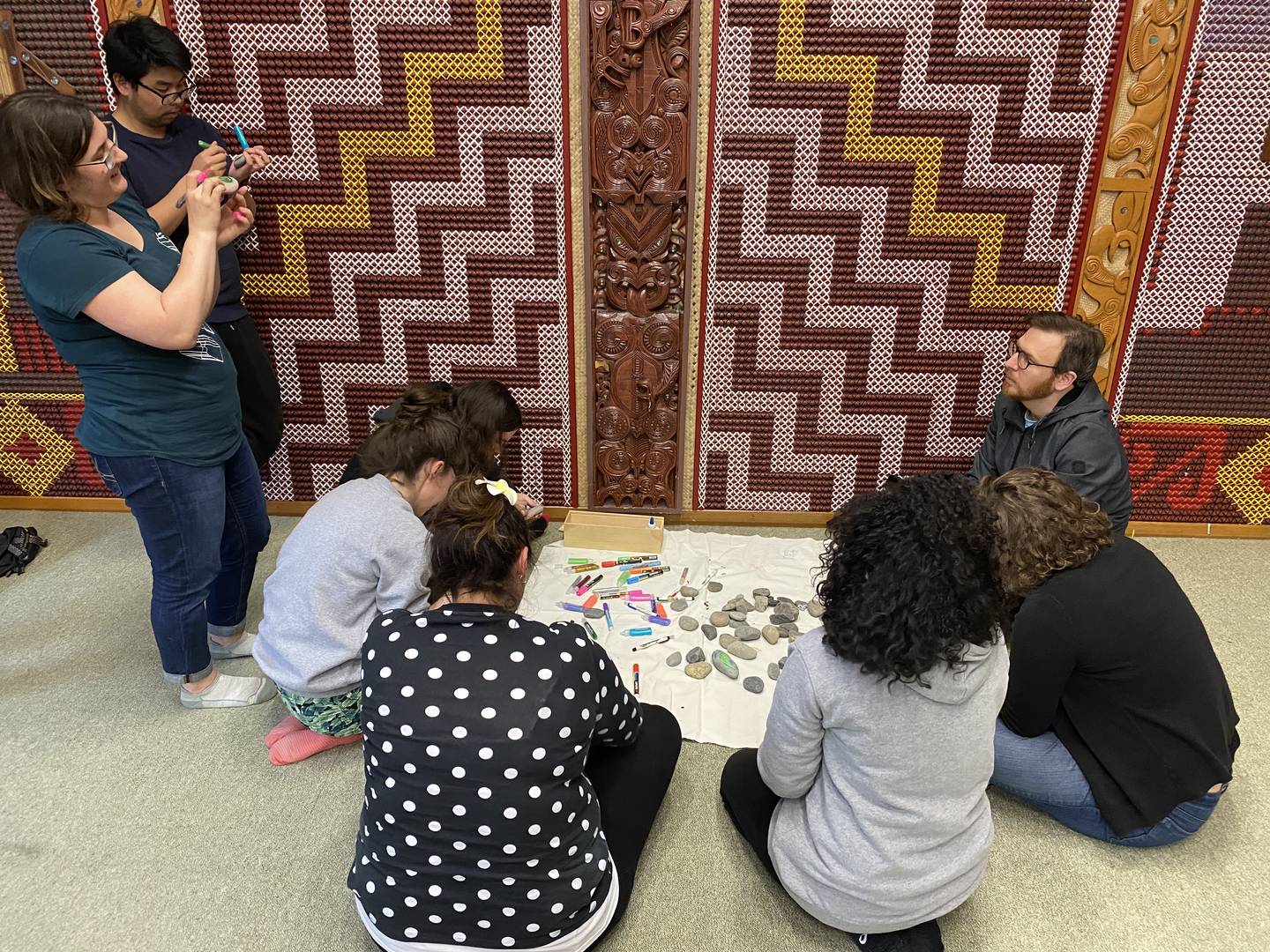 Springloaders decorating rocks to gift each other at the end of their stay at Koraunui Marae.