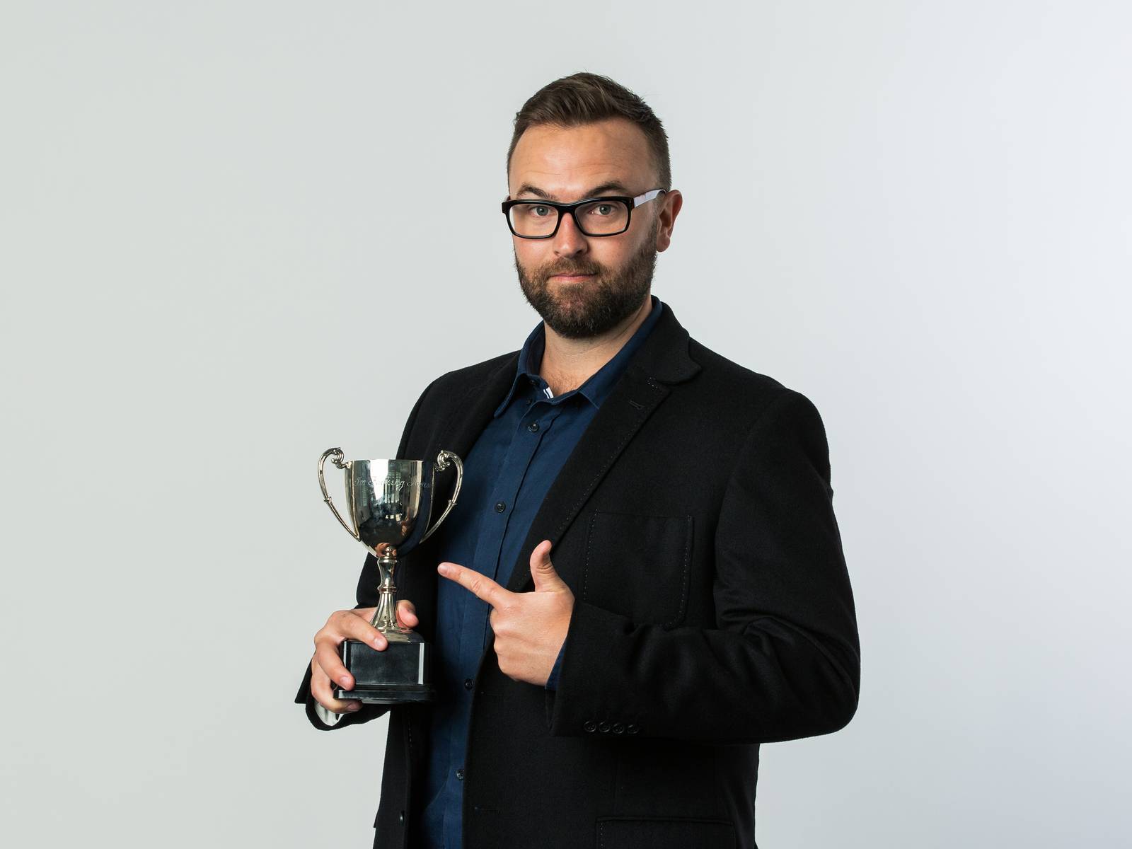Jonny holding a trophy