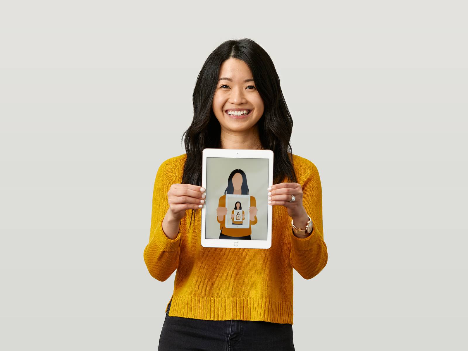 Joyce holding an iPad with illustration.jpg