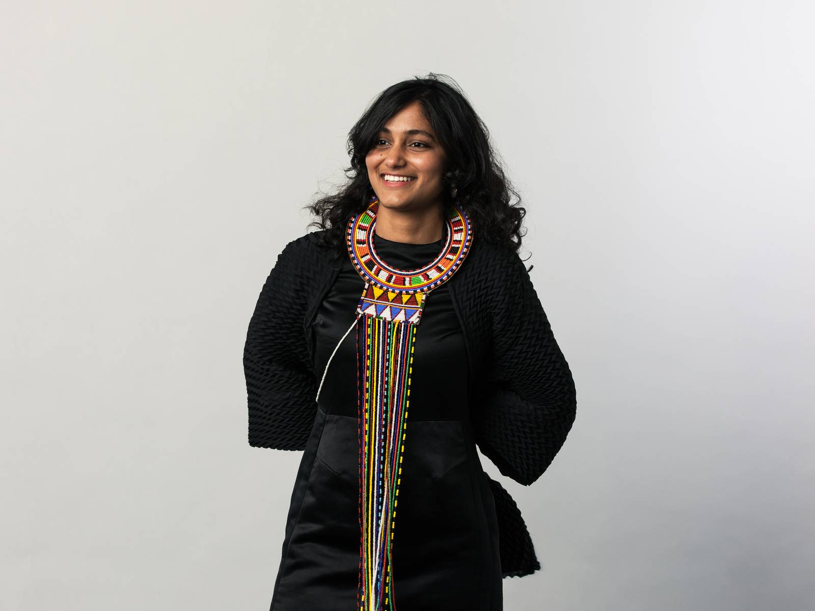 Kanhika, wearing a traditional colourful beaded maasai necklace from Kenya
